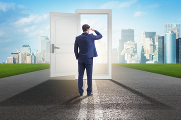 Fototapeta premium Businessman in front of door in business opportunities concept