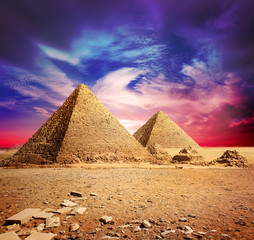 Fototapeta na wymiar Pyramids and violet clouds