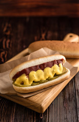 Hotdog with on a wooden board