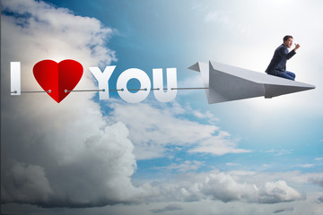Obraz premium Romantic concept with man on paper plane I Love you