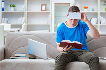 Young man student studying with virtual glasses