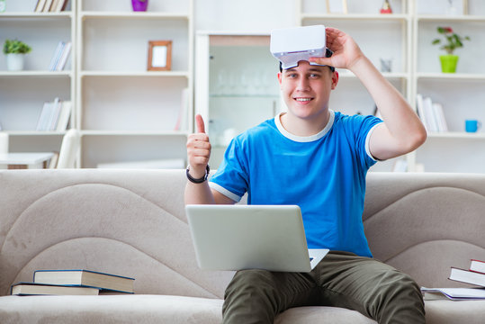 Young man student studying with virtual glasses