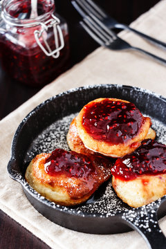 Homemade fried Pancakes with Raspberry jam. Breakfast concept.