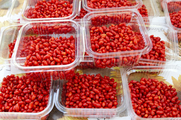 Fresh organic Goji, goji berry or wolfberry fruits in plastic bowl