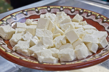 White brine cheese from cow, goat or sheep milk ready for eating . White brine bulgarian sirene ready for consummation. Traditional cheese from Balkans. Cubes of Bulgarian sirene white brine cheese