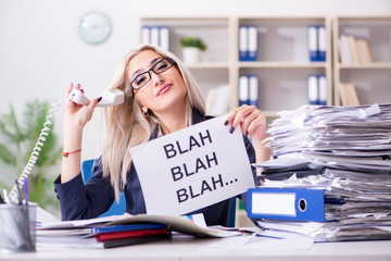Businesswoman with message in office at desk