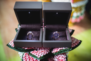 Two wedding rings in boxes. Set up to engagement in ceremony.