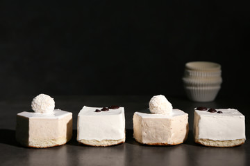 Tasty souffle cakes on dark background