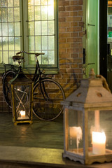 antique night cafe in the old town with brick tenements beautifully and romantically illuminated with large glass lanterns, lights and lanterns
