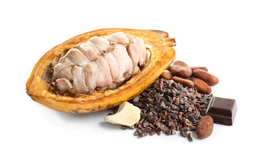 Cut cocoa pod and products on white background