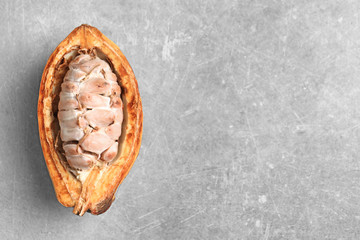 Naklejka premium Cut cocoa pod on grey background