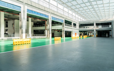 interior of parking garage with car and vacant parking lot in parking building