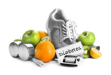 Composition with digital glucometer, sneakers, dumbbells and fruits on white background. Diabetes...