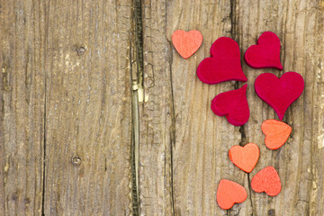 red hearts on wooden background