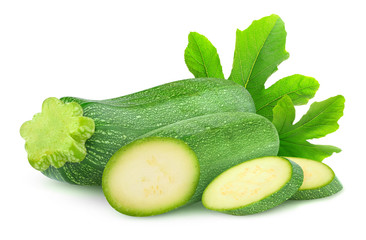 Isolated zucchini. Whole and cut courgettes isolated on white background with clipping path