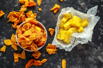 Tasty organic dried mango chips in bowl. healthy food