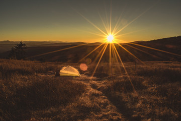 Tent camping at sunset 