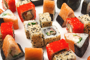 Set of sushi, maki and rolls on white background