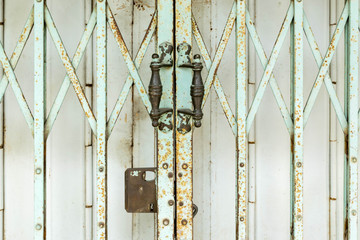 Old rusty iron shutters door