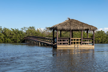 Boardwalk and Tiki Hut Over the Water