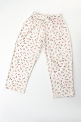 Cute white sleepwear pants with flower pattern and drawstring. Pajama bottom. Daughter's clothes.