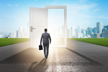 Businessman in front of door in business opportunities concept