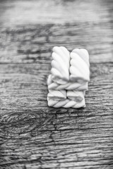 marshmallow cubes on wooden background