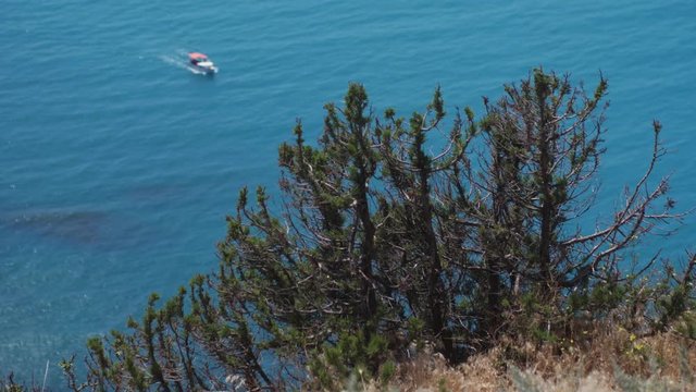 Aerial view from a Cape of Fiolent and changing focus to the yaght. Crimea. Slow motion. 3840x2160