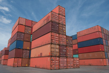 Fototapeta premium Shipping containers stacking at yard in depot as in logistics business shipping background.