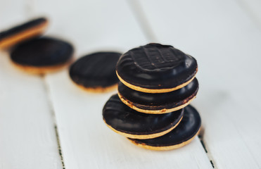biscuit cookies with filling in chocolate glaze