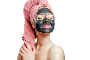 beautiful pretty sexy girl with black face mask on the white background,  close-up portrait, isolated, girl with a pink towel on her head, girl is smiling, black mask on girl's face, enjoys