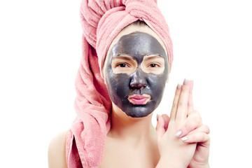 beautiful sexy girl with black face mask on the white background,  close-up portrait, isolated, girl with a towel on her head, black mask on girl's face, is indulging, like a criminal