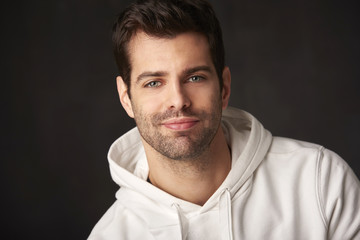 Young man studio portrait with positive vibes