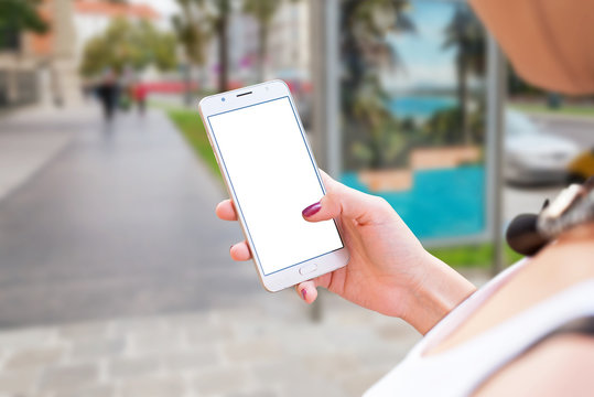 Woman use mobile phone on city streets. Isolated screen for mockup, app or responsive web site presentation.