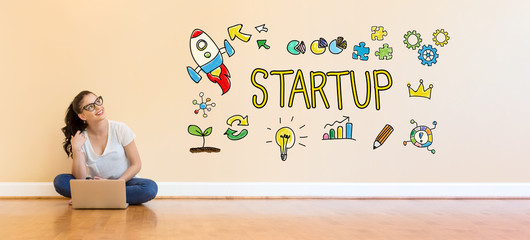 Startup text with young woman using a laptop computer on floor