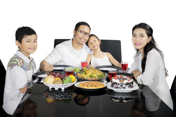 Asian family having dinner together on studio