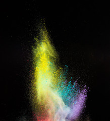 Launched colorful powder, isolated on black background