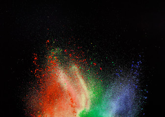 Launched colorful powder, isolated on black background