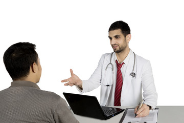 Arabian doctor talking with his patient on studio