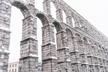 snowy aqueduct of Segovia, Spain
