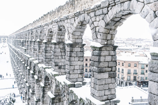 snowy aqueduct of Segovia, Spain