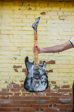 hipster man in the street with guitar old