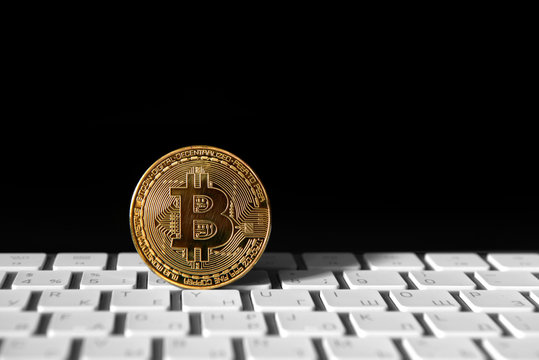 Bitcoin gold coin on keybord