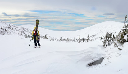 Naklejka na ściany i meble Alpine touring skier in winter mountain