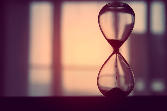 Hourglass As Time Passing Concept For Business Deadline.