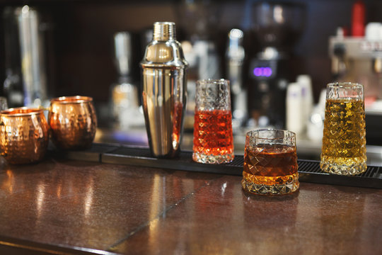Creative alcoholic cocktails assortment on bar