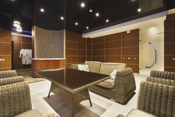 Modern hotel lobby with wicker furniture