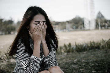 Close up asian sad woman heartbreak from From unrequited love,Brokenheart young girl concept,vintage style,dark tone