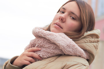 lovely girl in a light pink scarf. portrait.