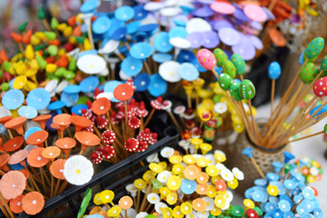 Fototapeta na wymiar Colorful ceramic flowers sold on Easter market in Vilnius.